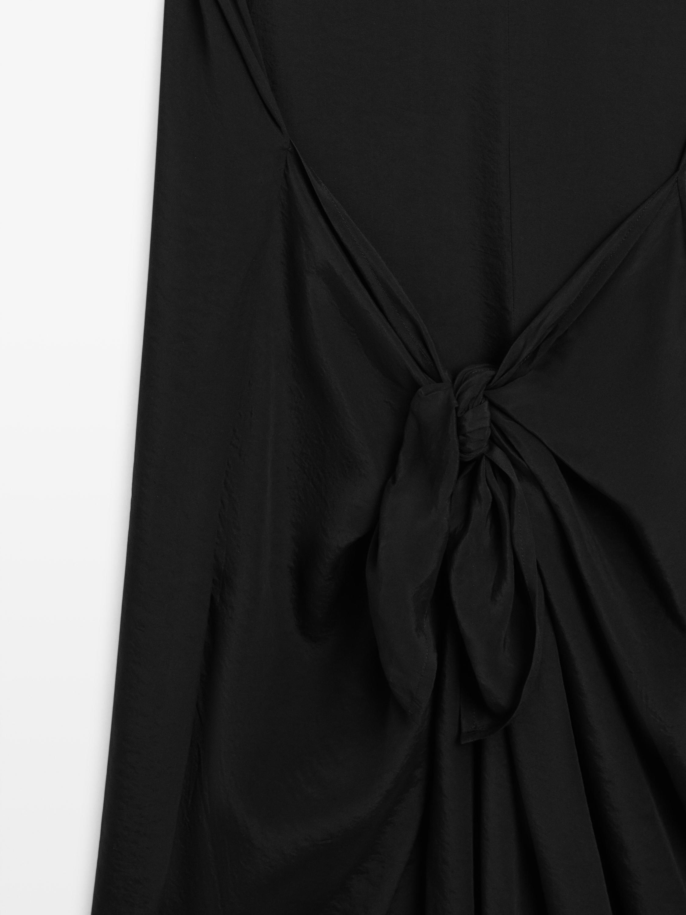 Flowing jumpsuit with knot detail